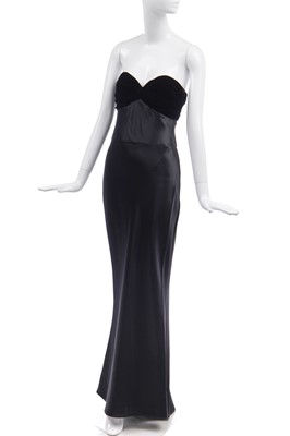 Lot 137 - An Yves Saint Laurent couture black satin evening gown, circa 1996
