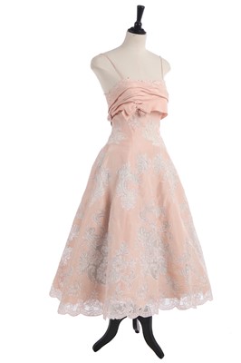 Lot 234 - A pink silk and lace evening gown, circa 1956