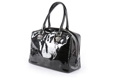Lot 6 - A Versace black patent leather handbag, circa...