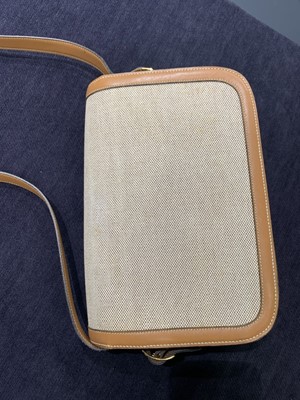 Lot 53 - An Hermès canvas and natural leather shoulder bag, 1960s