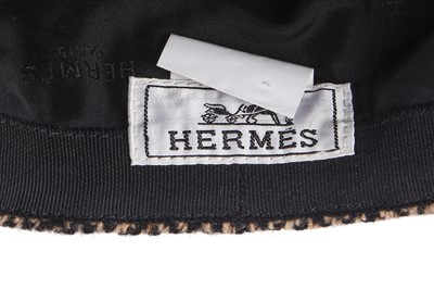 Lot 62 - An Hermès herringbone tweed flat cap, modern