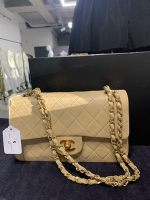 Lot 5 - A Chanel quilted beige leather classic double-flap bag, 1989-91