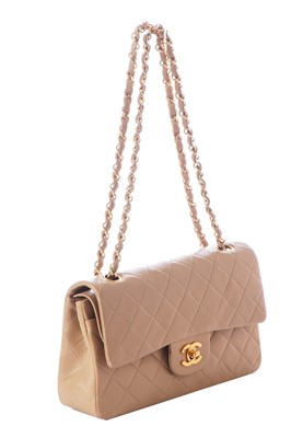 Lot 5 - A Chanel quilted beige leather classic double-flap bag, 1989-91