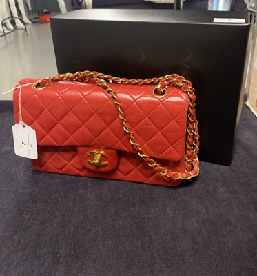 Lot 2 - A Chanel quilted red lambskin leather classic double-flap bag, 1991-94