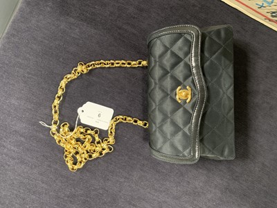 Lot 9 - A Chanel quilted black satin evening bag, 1994-96