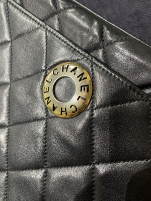 Lot 7 - A Chanel quilted black leather flap bag, 1980s