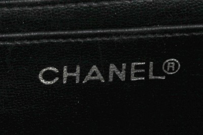 Lot 7 - A Chanel quilted black leather flap bag, 1980s