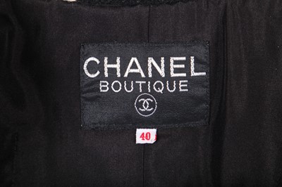 Lot 9 - A Chanel black tweed suit, 1980s