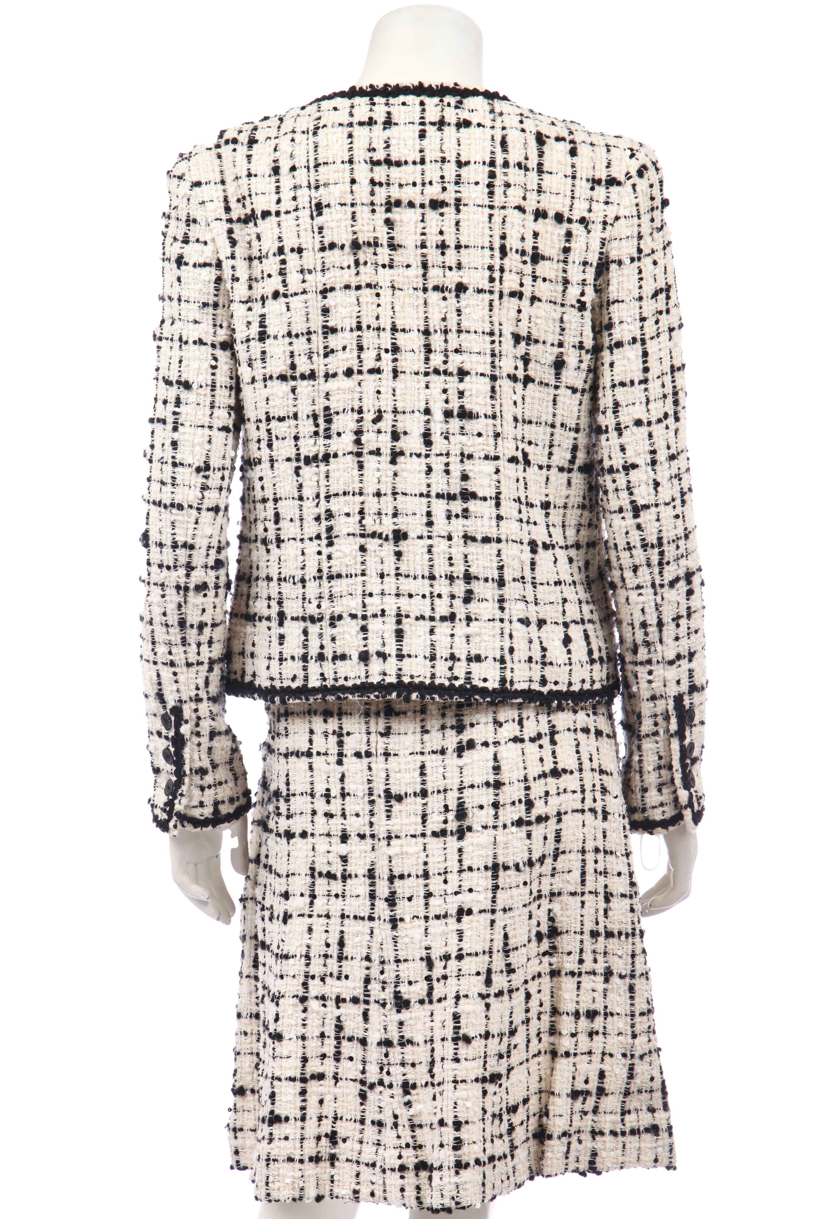 Lot 10 - A Chanel bouclé tweed suit, Cruise collection