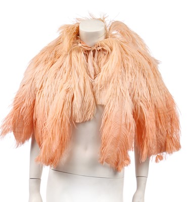 Lot 414 - An ostrich feather cape in ombré peach, 1930s