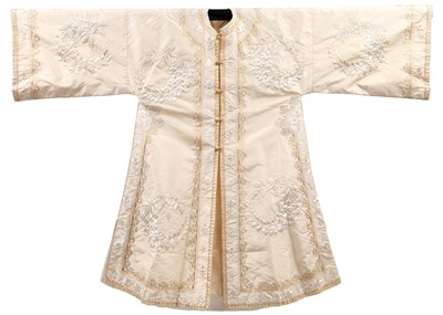 Lot 488 - A Liberty & Co. chinoiserie embroidered ivory silk robe, circa 1910