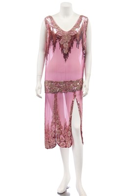 Lot 223 - An ombré sequined and beaded pink chiffon flapper dress, circa 1925