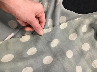 Lot 420 - A polka-dot blue-grey chiffon evening gown, 1930s