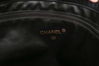 Lot 82 - A Chanel navy lambskin leather shopper, 1980s,...