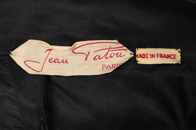 Lot 382 - A Jean Patou couture black taffeta dinner dress, early 1950s