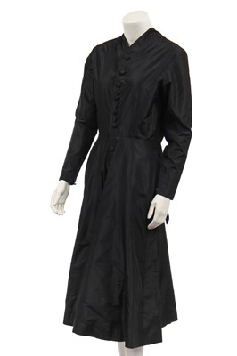 Lot 382 - A Jean Patou couture black taffeta dinner dress, early 1950s