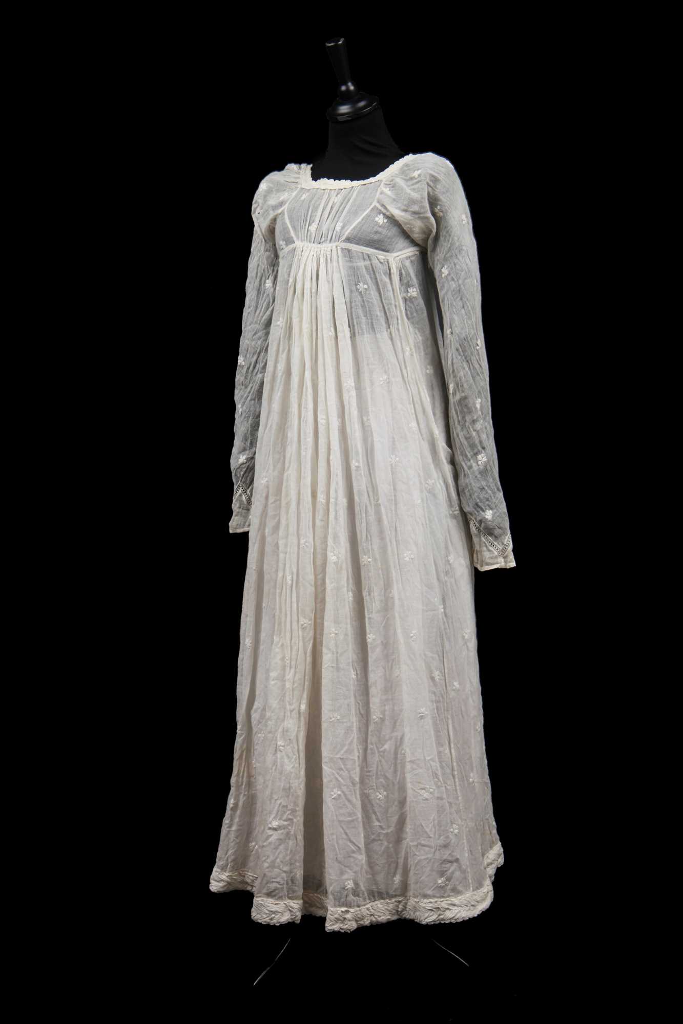 Sprigged Lot 520 - A sprigged muslin dress, 1805-10,