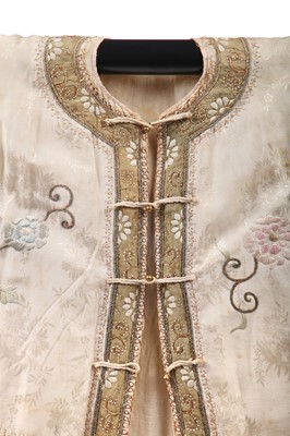 Lot 551 - An embroidered ivory silk skirt, Chinese, 1920s
