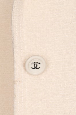 Lot 14 - A Chanel cream wool dress and matching jacket,...