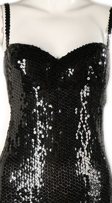 Lot 141 - A Loris Azzaro black sequinned evening gown,...