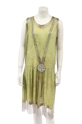 Lot 480 - A chartreuse muslin beaded flapper dress, circa 1928