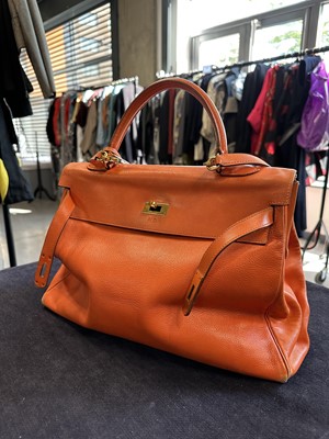 Lot 186 - A Hermès orange Swift leather Retournè Kelly 35, 1995