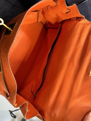 Lot 186 - A Hermès orange Swift leather Retournè Kelly 35, 1995