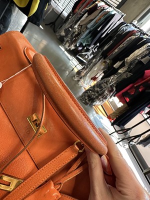 Lot 186 - A Hermès orange Swift leather Retournè Kelly 35, 1995