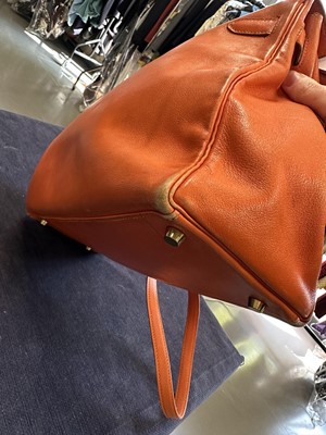Lot 186 - A Hermès orange Swift leather Retournè Kelly 35, 1995