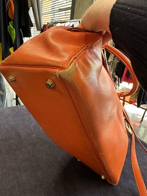 Lot 186 - A Hermès orange Swift leather Retournè Kelly 35, 1995