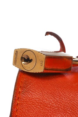 Lot 186 - A Hermès orange Swift leather Retournè Kelly 35, 1995