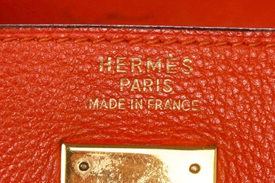 Lot 186 - A Hermès orange Swift leather Retournè Kelly 35, 1995