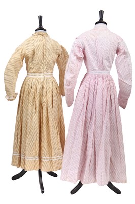 Lot 516 - Three girl/adolescent printed cotton summer dresses, early 1860s