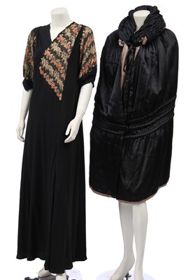 Lot 486 - A Marshall & Snelgrove black and silver satin cape, 1920s