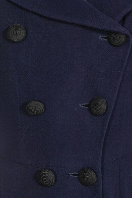 Lot 381 - A Marcel Rochas couture navy wool double-breasted coat, early 1950s