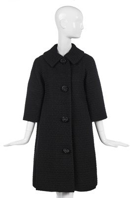 Lot 260 - A Christian Dior, black ribbed wool coat, 1958-60