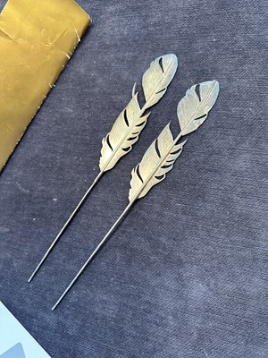 Lot 439 - A pair of rare Slim Barrett for John Galliano metal feather ornaments, 'Dolores' collection, Autumn-Winter 1995-96