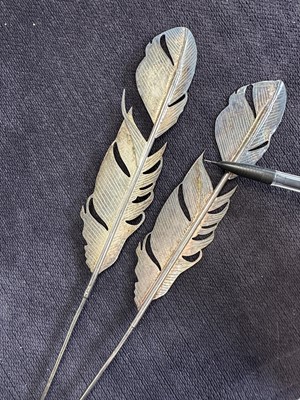 Lot 439 - A pair of rare Slim Barrett for John Galliano metal feather ornaments, 'Dolores' collection, Autumn-Winter 1995-96