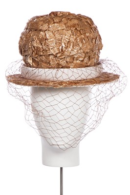 Lot 304 - A Christian Dior woven cellophane-straw hat, early 1960s