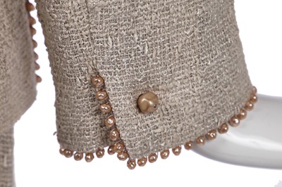 Lot 179 - A Chanel buff-coloured bouclé cotton suit, Spring-Summer 1999