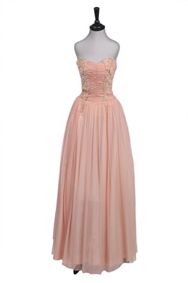 Lot 246 - A Nina Ricci couture pink chiffon evening gown, 1950s