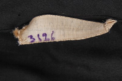 Lot 243 - An Elsa Schiaparelli couture black wool-crêpe jacket, circa 1935
