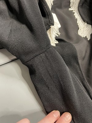Lot 243 - An Elsa Schiaparelli couture black wool-crêpe jacket, circa 1935