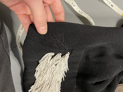 Lot 243 - An Elsa Schiaparelli couture black wool-crêpe jacket, circa 1935