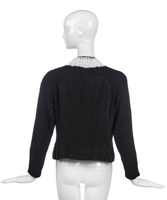 Lot 243 - An Elsa Schiaparelli couture black wool-crêpe jacket, circa 1935