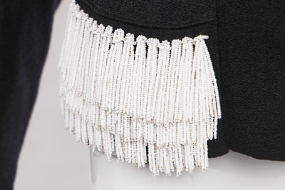 Lot 243 - An Elsa Schiaparelli couture black wool-crêpe jacket, circa 1935