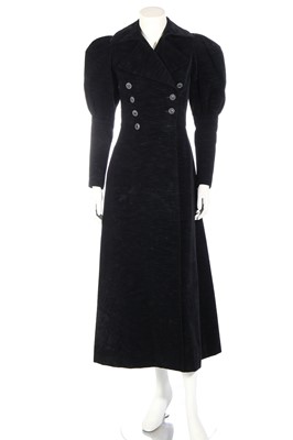 Lot 361 - An Yves Saint Laurent black ribbed velvet double-breasted coat, late 1960s