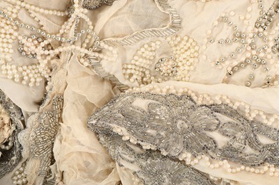 Lot 264 - A group of dress trimmings and beaded remnants,...