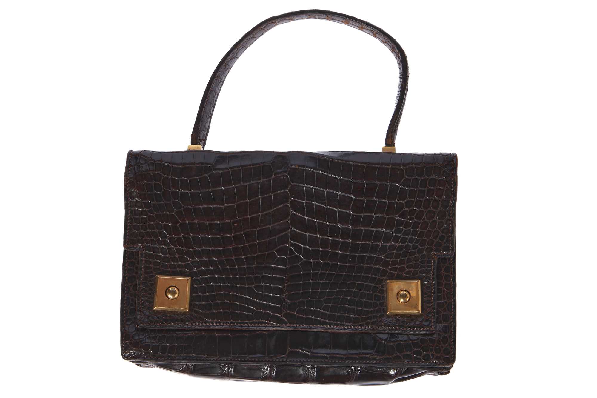 Lot 58 - An Hermès dark brown `Piano' crocodile bag, 1960s