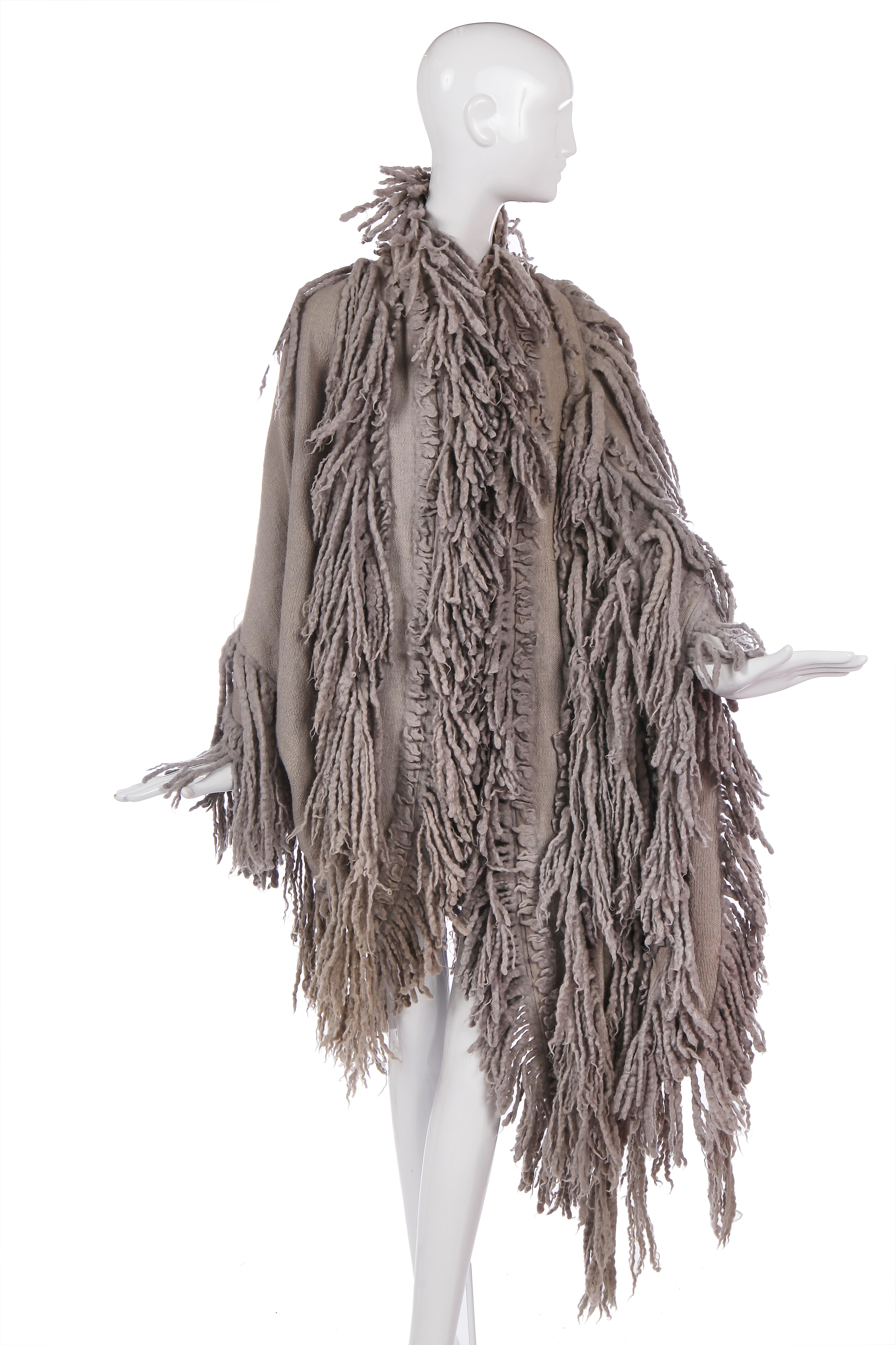 Lot 527 - An Issey Miyake fringed grey wool coat,